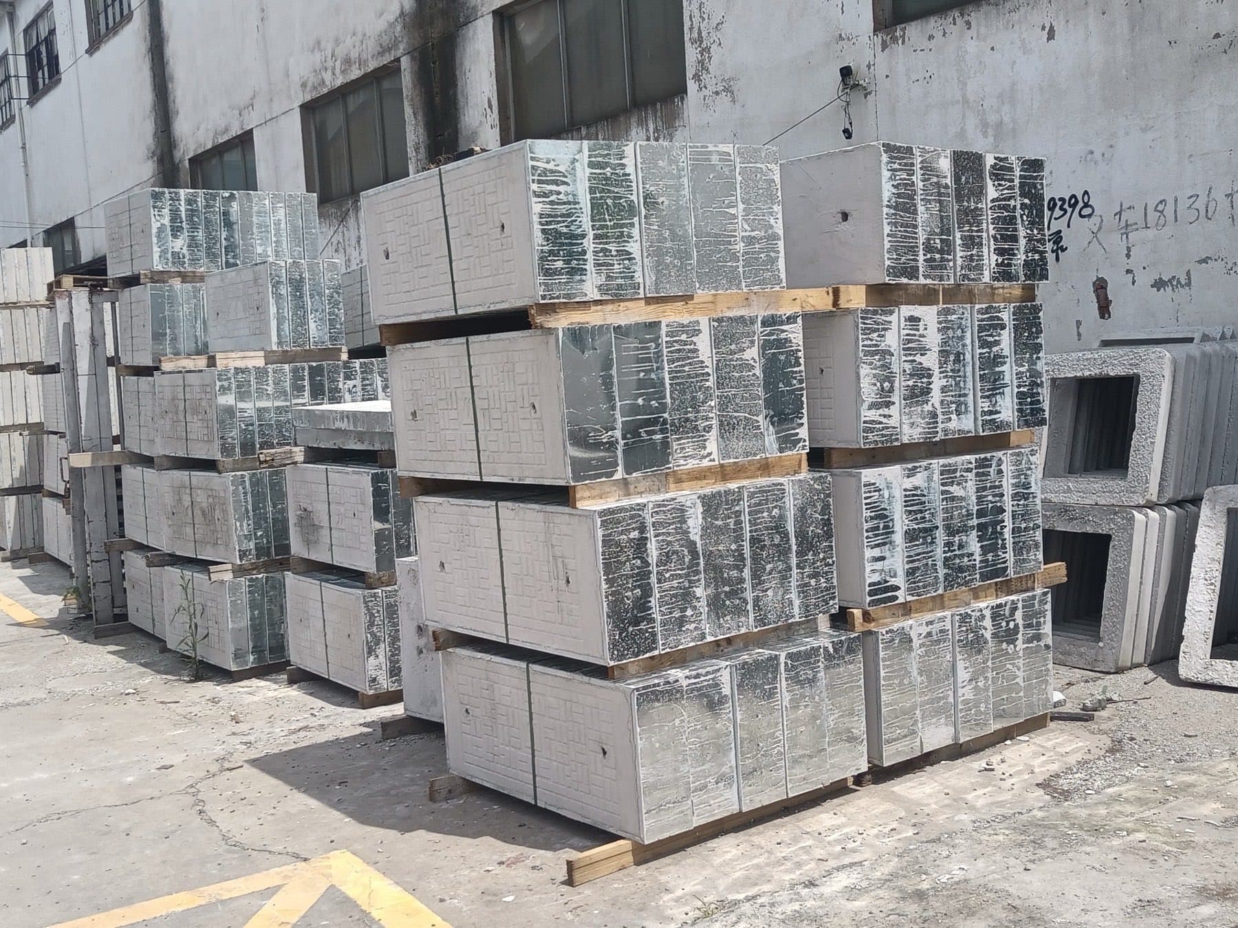 Palletised precast concrete covers stacked in a plant yard