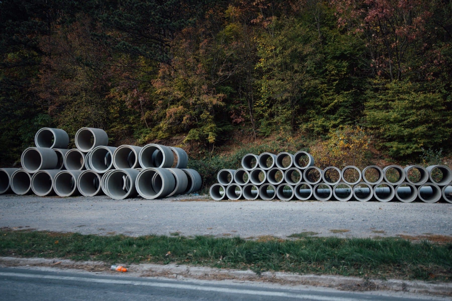 Reinforced concrete pipe stacked in a yard
