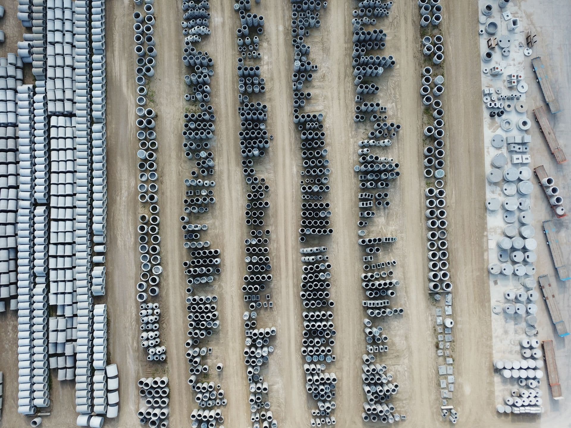 Aerial view of a precast yard stacked with thousands of pipes, manholes and box sections